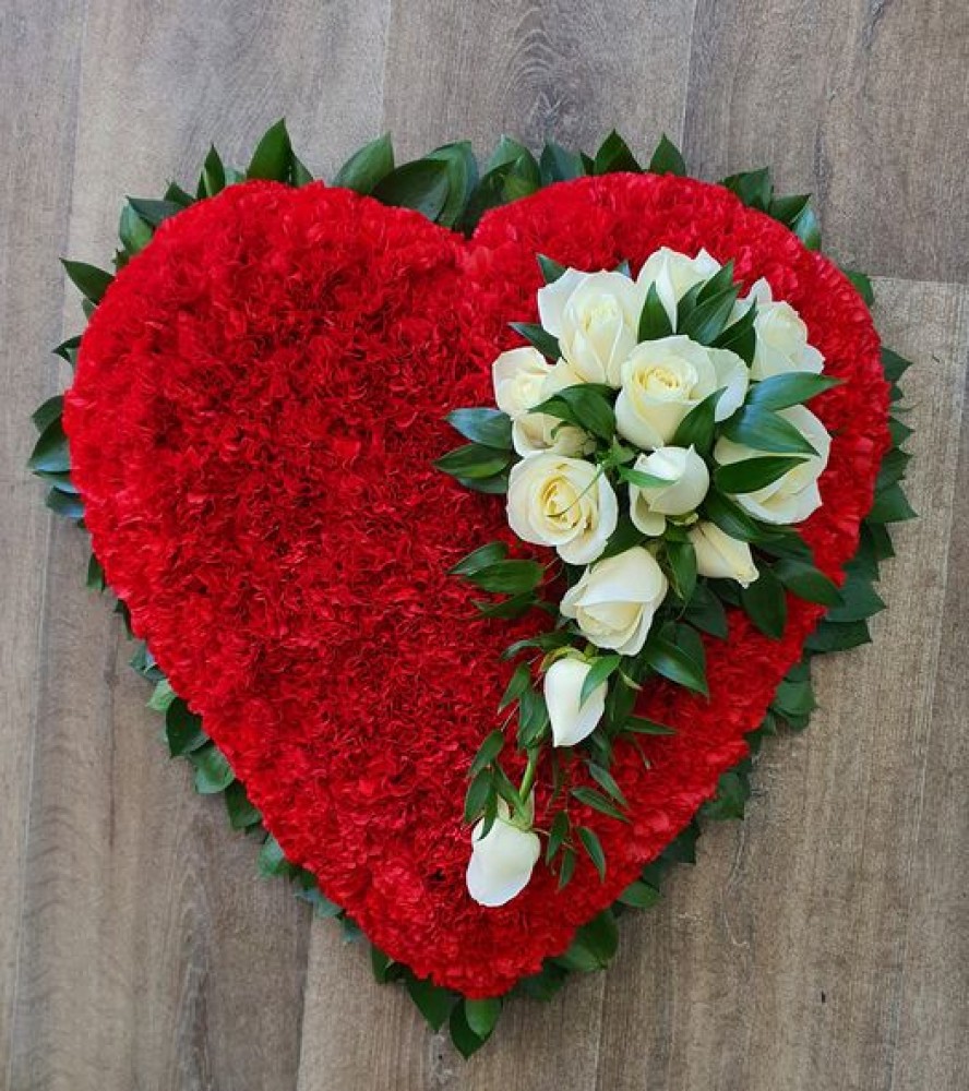 red carnation heart with ivory rose spray