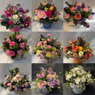 The round pot arrangement - A lovely gift suitable for placing on a table or coffee table the arrangement looks great from all views, the pictures are of ones previously made but you can say if you have a prefered colour range whether it be all neutral, pink shades or even bright and colourful n.b the pot may vary it could be ceramic or maybe zinc we generally choose the best container to match the flowers, as always you can state if you have any preferences or dislikes.