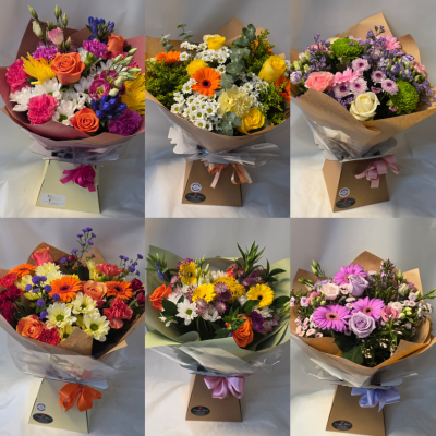 The florist choice aqua - These are mixed bouquets tied, in water and placed in a box or bag.