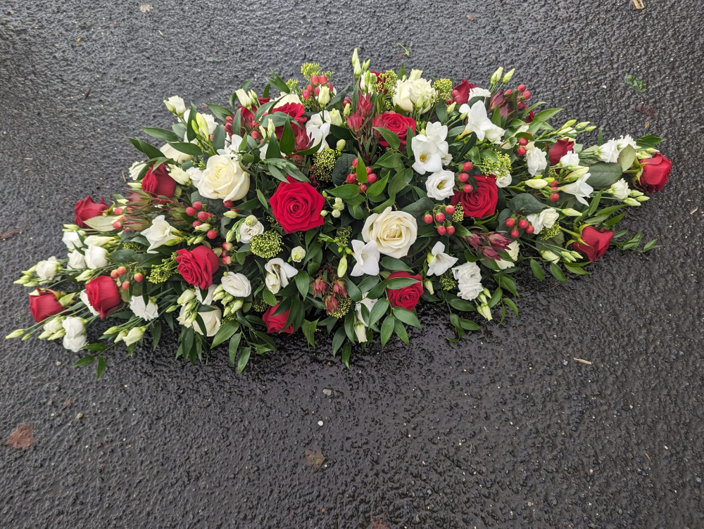 wintery casket spray