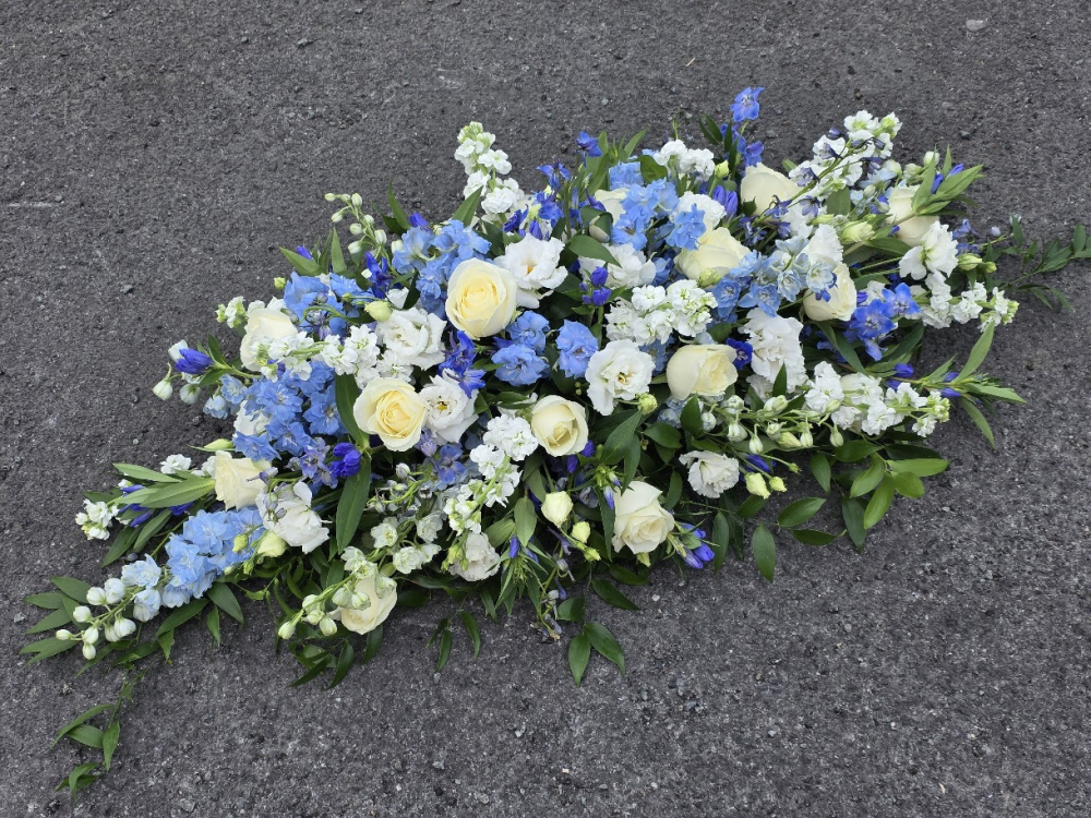 blues and white casket spray