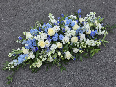 blues and white casket spray - mid and pale blues with white and ivory, not available autumn and winter months, summer is best for varieties n.b these may vary due to availability  4ft, 5ft or 6 ft sizes