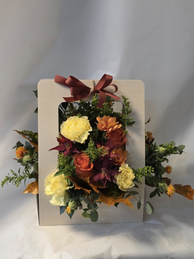 Autumn wishes - floral card arrangement in autumnal colours of generally orange, bronze, yellow etc