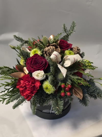 Festive forest hatbox - luxurious hatbox arrangement, fresh winter greens with rich redcrisp white blooms, this festive display brings a cosy, charming beauty to anyhome by adding warmth and elegance