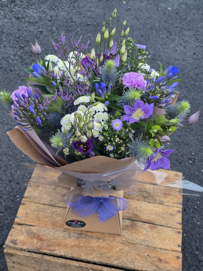 blue, lilac, purple and white aqua - one of the most requested colour combination but not the biggest varity of flowers come in these colours so best to order in advance if possible, this is an example of one previously made n.b may vary but will be similar