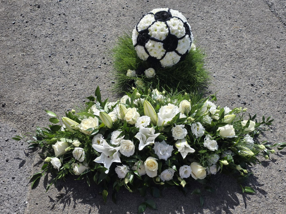 football and casket spray