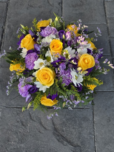 pg 83e funeral posy - funeral posy with yellow roses, purple lisianthus, lilac carnations, limonium and chrysanthemums