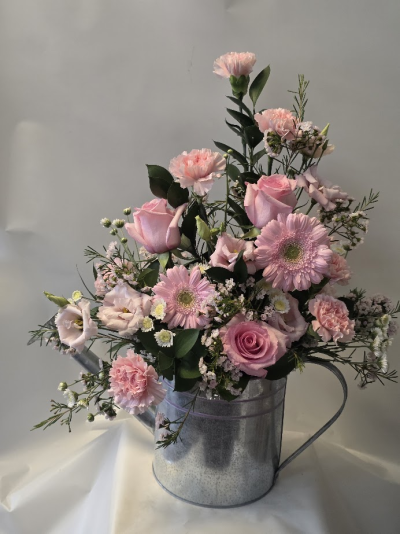 soft pink watering can arrangement - Experience the charm of 'Pink Watering Can' from Six Ways Florist. This delightful arrangement in soft pink hues exudes elegance and joy, perfect for brightening any occasion in Llanelli. A truly enchanting gift.