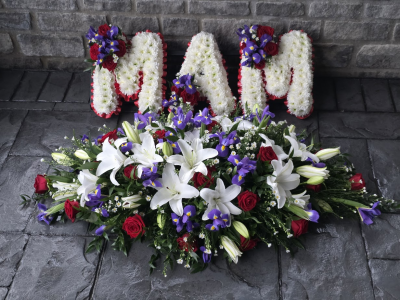 matching 3 letters and casket sp with lily, rose and iris - Elevate memories with our 'mam & casket with our lily, rose and  iris' letters and casket spray from Six Ways Florist, Llanelli. A harmonious blend of vibrant reds, whites, and purples, perfect for expressing heartfelt sentiments and celebrating cherished memories. standard 3 letters,