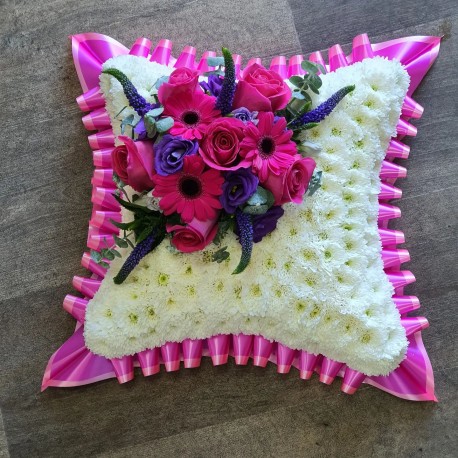 cushion in bright pink and purple